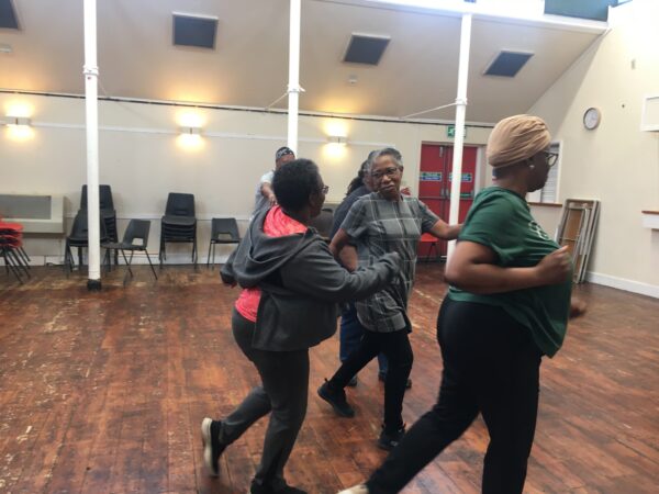 A group of participants dancing together